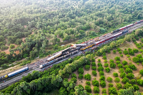 A drone view shows heavy machinery removing damaged coaches following a collision between two passenger trains in Vizianagaram district in the southern Andhra Pradesh, India on October 30, 2023. Image: Reuters / R.Narendra