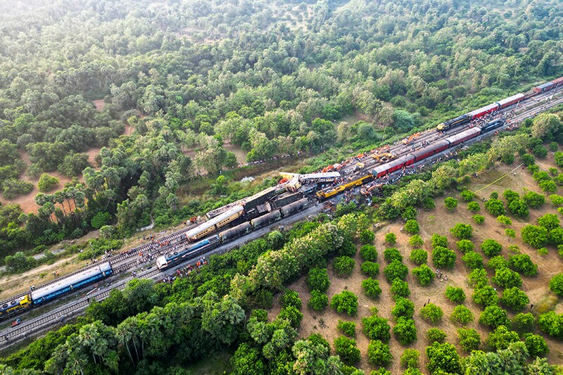 A drone view shows heavy machinery removing damaged coaches following a collision between two passenger trains in Vizianagaram district in the southern Andhra Pradesh, India on October 30, 2023. Image: Reuters / R.Narendra