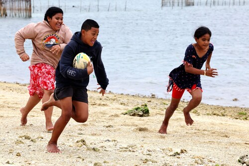 Lesieli, Siua and Sisi play a game of touch rugby by the beach at Popua on July 20, 2023, in Nuku’alofa while their families are fishing on the reef.
Image: Nuku Alofa, Tonga Lesieli, Siua and Sisi play a game of touch rugby by the beach at Popua on July 20, 2023, in Nuku’alofa while their families are fishing on the reef.
Image: Nuku Alofa, Tonga