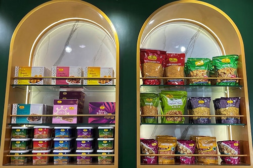 A view shows packets of snacks on the shelves inside a Haldiram"s restaurant in Mumbai, India. Image: M Sriram/Reuters