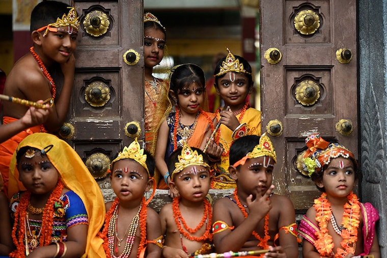 Children dressed as Lord Krishna and Radha take part in the celebrations on the eve of Janmashtami festival, in Chennai, on September 6, 2023. Image: R. Satish Babu/AFP