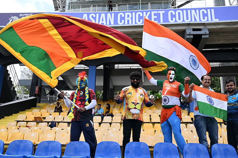 Sri Lankan and Indian cricket fans wave their country flags from the stands before the start of the Asia Cup 2023 Super Four ODI match between Sri Lanka and India at the R. Premadasa Stadium in Colombo on September 12, 2023.