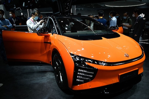 HiPhi, has launched a car that can use its headlights to project a film against a wall and symbols on the road. It can even display emoticons on screens under its headlights letting know pedestrians they can pass.
Image: Wang Zhao / AFP© HiPhi, has launched a car that can use its headlights to project a film against a wall and symbols on the road. It can even display emoticons on screens under its headlights letting know pedestrians they can pass.
Image: Wang Zhao / AFP©