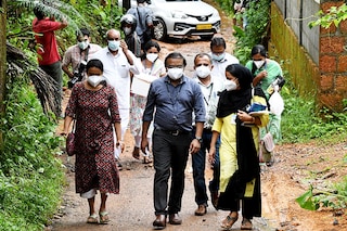 Members of a medical team from Kozhikode Medical College carry areca nut and guava fruit samples to conduct tests for Nipah virus in Maruthonkara village in Kozhikode district, Kerala, India on September 13, 2023. Image: Reuters/Stringer