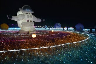 Tourists play at the "Harvest and Colorful Light Festival" at Happy Farm in Zhangjiakou, Hebei province, China, September 15, 2023.