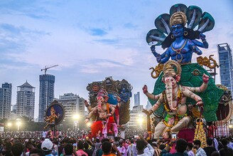 Devotees prepare to immerse large idols of Lord Ganesh on the last day of the ten-day-long Ganpati Festival in Mumbai, India, on September 28, 2023.