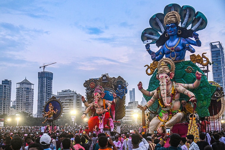 Devotees prepare to immerse large idols of Lord Ganesh on the last day of the ten-day-long Ganpati Festival in Mumbai, India, on September 28, 2023.