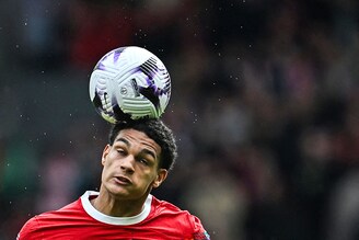 Liverpool"s defender, Jarell Quansah, heads the ball during the English Premier League football match between Liverpool and Brighton and Hove Albion, at Anfield in Liverpool, on March 31, 2024.