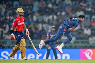 Lucknow Super Giants" Mayank Yadav bowls as Punjab Kings" captain Shikhar Dhawan (L) watches during the Indian Premier League (IPL) Twenty20 cricket match between Lucknow Super Giants and Punjab Kings at the Ekana Cricket Stadium in Lucknow on March 30, 2024.
Image: Arun Sankar / AFP