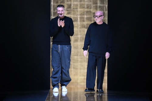 Domenico Dolce (R) and Stefano Gabbana greet the audience from the runway
Image: Marco Bertorello / AFPÂ©
