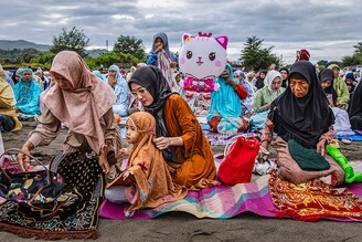 Indonesian Muslims attend the Eid Al-Fitr prayer on the "sea of sands" at Parangkusumo beach on April 10, 2024, in Yogyakarta, Indonesia. Muslims around the world celebrate Eid al-Fitr with their families with feasts to mark the end of Ramadan, the holy month of fasting.