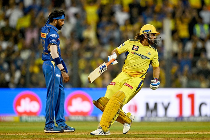 Chennai Super Kings" MS Dhoni runs between the wickets as Mumbai Indians" captain Hardik Pandya looks on during the Indian Premier League (IPL) Twenty20 cricket match between MI and CSK at the Wankhede Stadium in Mumbai on April 14, 2024. In the clash of the Titans, MS Dhoni"s 20 runs in the death overs of CSK innings proved crucial, as that was the margin with which Chennai defeated the Mumbai squad.