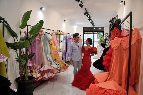 Luis Fernandez"s workshop in Seville"s Old City is buzzing with customers who have come to try on his dazzling array of flamenco dresses. Image: Cristina Quicler/AFP Luis Fernandez"s workshop in Seville"s Old City is buzzing with customers who have come to try on his dazzling array of flamenco dresses. Image: Cristina Quicler/AFP