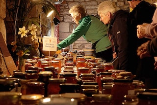 A screenshot taken from an AFP TV video, shows people browsing jars of marmalade entered into the annual Dalemain world marmalade awards, in Penrith. Photography Justine GERARDY / AFPÂ©