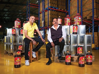 (From left) Ashish Khandelwal, managing director, and Ghanshyam Khandelwal, chairman of BL Agro at the Bail Kolhu packaging plant in Bareilly
Image: Amit Verma
