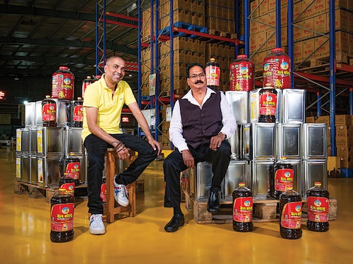 (From left) Ashish Khandelwal, managing director, and Ghanshyam Khandelwal, chairman of BL Agro at the Bail Kolhu packaging plant in Bareilly
Image: Amit Verma