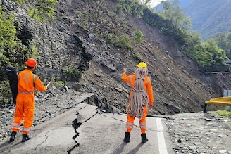 This handout photograph released by India"s National Disaster Response Force (NDRF) shows NDRF personnel deployed to evacuate stranded pilgrims at Kedarnath, after landslides washed away major road on the route on August 1, 2024. Monsoon downpours and cloudburst caused flash floods that killed 13 people in India"s Himalayan foothills, officials said on August 2, with helicopters rescuing hundreds stranded near the renowned shrine.