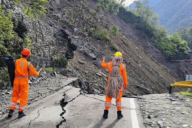 This handout photograph released by India"s National Disaster Response Force (NDRF) shows NDRF personnel deployed to evacuate stranded pilgrims at Kedarnath, after landslides washed away major road on the route on August 1, 2024. Monsoon downpours and cloudburst caused flash floods that killed 13 people in India"s Himalayan foothills, officials said on August 2, with helicopters rescuing hundreds stranded near the renowned shrine.
