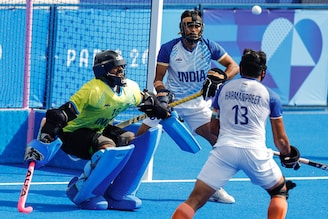Harmanpreet Singh of India and goalie Sreejesh Raveendran of India in action during a penalty corner in the men"s hockey quarter final against Great Britain in Yves-du-Manoir Stadium, Colombes, France, at the Olympic Games, on August 04, 2024. In a remarkable defensive performance, the Indian team played with one player less for 42 minutes to a 1-1 draw and won 4-2 in the shootout to qualify for the semi-finals. Image: Adnan Abidi / Reuters