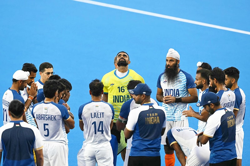 India"s players gather in a huddle after their defeat in the men"s semi-final field hockey match between Germany and India during the Paris 2024 Olympic Games at the Yves-du-Manoir Stadium in Colombes on August 6, 2024.