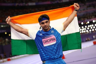 India"s star javelin thrower, Neeraj Chopra, posed with the Indian flag after clinching a silver medal at the Paris Olympics with a throw of 89.45m. This is India"s first silver this season. Pakistan"s Arshad Nadeem won the gold after setting a new Olympic record with a throw of of 92.97m.