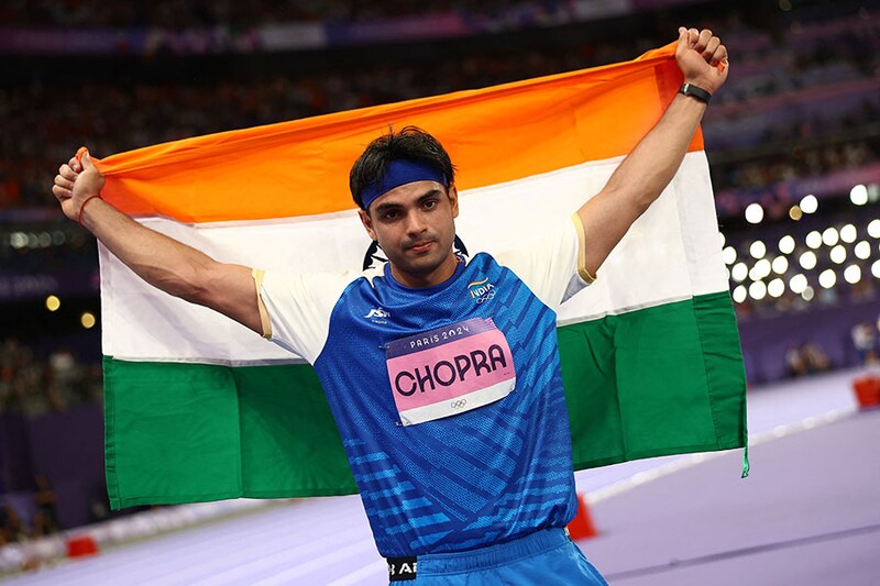 India"s star javelin thrower, Neeraj Chopra, posed with the Indian flag after clinching a silver medal at the Paris Olympics with a throw of 89.45m. This is India"s first silver this season. Pakistan"s Arshad Nadeem won the gold after setting a new Olympic record with a throw of of 92.97m.