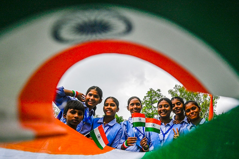 School students participate in the Har Ghar Tiranga campaign ahead of Independence Day at Gandhi Darshan on August 9, 2024 in New Delhi, India.