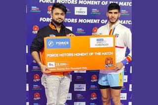 Somesh Thakre distributing the "Moment of the Match" prize money to the winner at an event held in Hyderabad