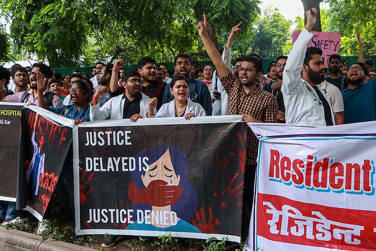 Medical professionals take part in a protest against the rape and murder of a doctor in India"s West Bengal state, in New Delhi on August 19, 2024.