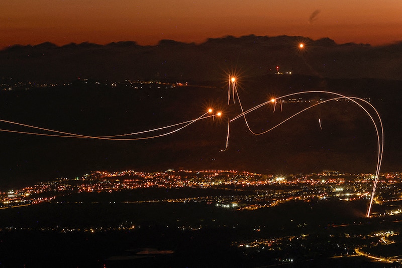 Rockets fired from southern Lebanon are intercepted by Israel"s Iron Dome air defence system over the Upper Galilee region in northern Israel on August 23, 2024.