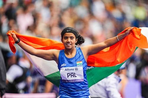 Preethi Pal of India celebrates winning bronze in Women"s 100m - T35 Final during the Paris 2024 Paralympic Games at Stade de France on August 30, 2024.