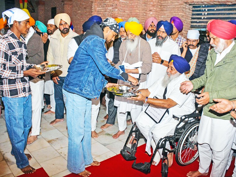 As per tankhah (religious punishment) awarded by Akal Takht, Shiromani Akali Dal (SAD) president Sukhbir Singh Badal, SAD working president Balwinder Singh Bhunder, SAD leader Daljeet Singh Cheema, Gulzar Singh Ranike performing sewa of collecting used utensils at Langar Hall in Golden Temple on December 3, 2024 in Amritsar, India. On Wednesday, Badal was allegedly attacked by a gunman at the Golden Temple while performing penance duties. The Akal Takht, the supreme temporal body of the Sikhs, punished Akali leaders for the mistakes the Shiromani Akali Dal committed during its alliance with the Bharatiya Janata Party (BJP) from 2007 to 2017.
