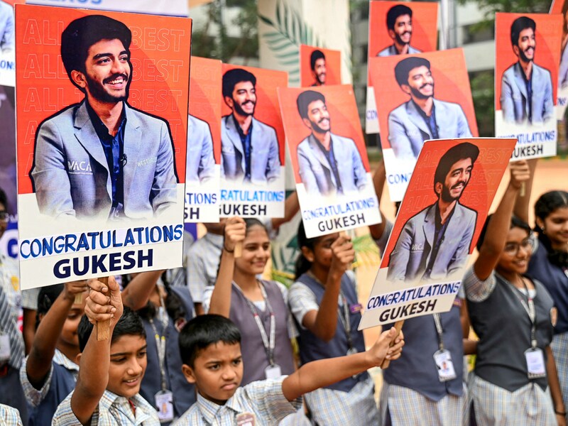 School students congratulate the world"s youngest chess champion Gukesh Dommaraju, in Chennai on December 13, 2024. Gukesh was seven when he watched Viswanathan Anand lose the world chess title in 2013 to challenger Magnus Carlsen of Norway—a match that fired up his dream to bring the crown back to India. Eleven years later, the 18-year-old beat China"s Ding Liren in a gruelling tournament to become the youngest world chess champion.