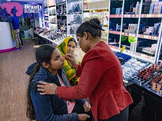 A young bride-to-be samples a makeup look under the watchful eyes of her mother at Moiza Studios, a multibrand beauty and skincare outlet in Aminabad, Lucknow. Image: Madhu Kapparath
