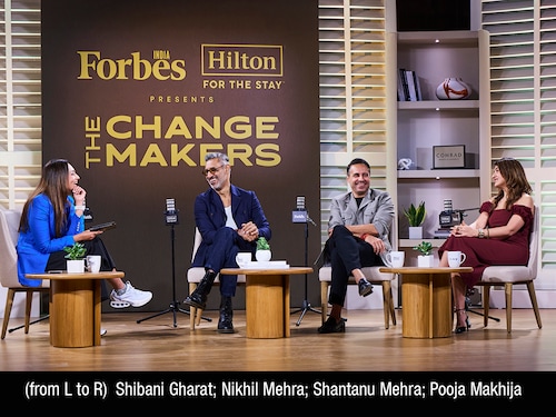 Pedestrians walk past the Eros Cinema, a UNESCO-designated Art Deco cinema theatre in the Cambata Building at Churchgate in Mumbai. Image: Indranil MUKHERJEE / AFPÂ©