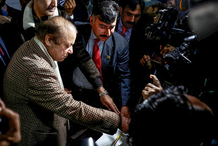 Former Prime Minister Nawaz Sharif casts his vote at a polling station during the general election in Lahore, Pakistan, on February 8, 2024. Voting began on Thursday for the 266 seats in the country"s National Assembly as the world"s fifth-most populous nation again takes the democratic test. With continued militant attacks, allegations of political engineering by the army, and accusations of electoral misconduct, the integrity of the process is already being criticised. Nawaz and Shehbaz Sharif"s Pakistan Muslim League-Nawaz, Imran Khan"s Pakistan Tehreek-e-Insaaf, and Bilawal Bhutto-Zardari"s Pakistan People"s Party are the key players vieing to secure the largest portion of the assembly. Victor must deal with soaring inflation, internal unrest, illegal migration, and a severe economic crisis.