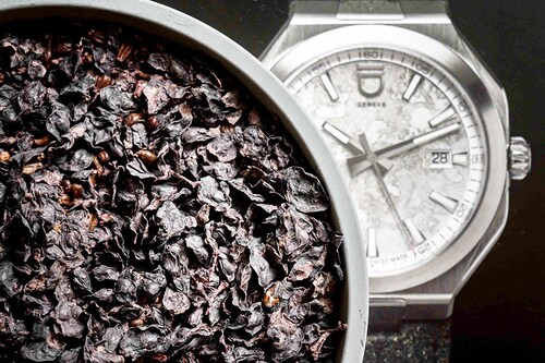 A photo taken on December 4, 2023 in Geneva shows parts of a plastic-free compostable material recycled for a vegan strap in front of a picture of a Circular model watch by ID Geneve brand.
Image: Fabrice Coffrini / AFP A photo taken on December 4, 2023 in Geneva shows parts of a plastic-free compostable material recycled for a vegan strap in front of a picture of a Circular model watch by ID Geneve brand.
Image: Fabrice Coffrini / AFP