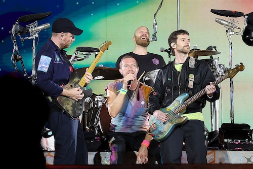 (L-R) Jonny Buckland, Chris Martin, Will Champion and Guy Berryman of Coldplay perform onstage at Rose Bowl Stadium on September 30, 2023 in Pasadena, California. Image: Monica Schipper / Getty Images North America / Getty Images via AFP (L-R) Jonny Buckland, Chris Martin, Will Champion and Guy Berryman of Coldplay perform onstage at Rose Bowl Stadium on September 30, 2023 in Pasadena, California. Image: Monica Schipper / Getty Images North America / Getty Images via AFP