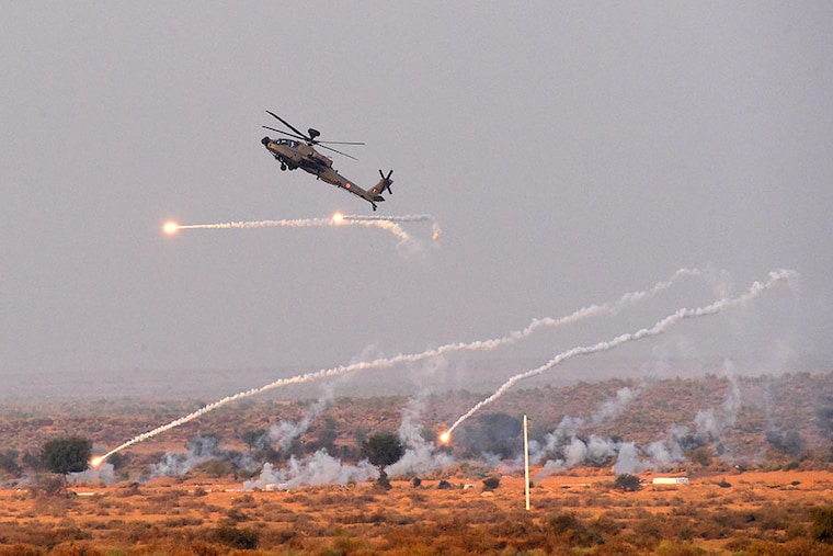 An Indian Air Force (IAF) Apache helicopter takes part in Exercise Vayu Shakti 2024 at Pokhran firing range in Rajasthan during a Full Dress Rehearsal on February 14, 2024.