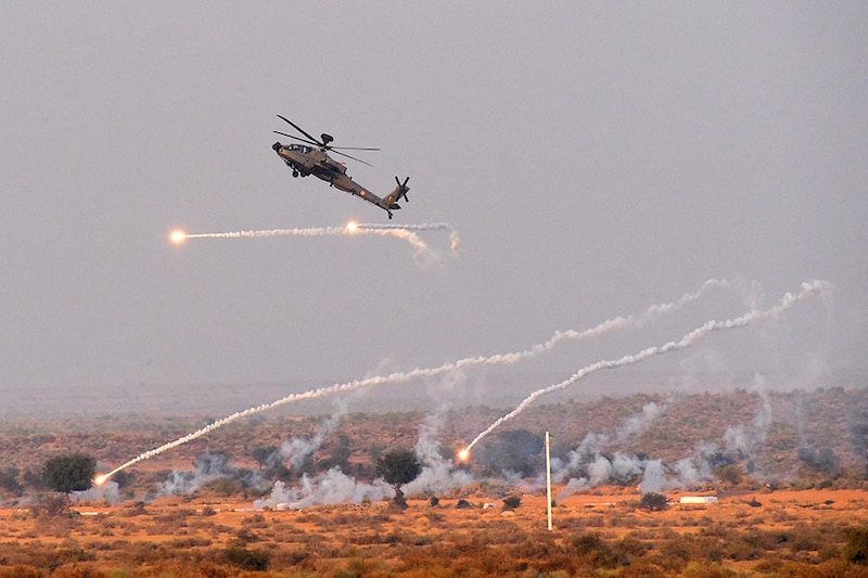 An Indian Air Force (IAF) Apache helicopter takes part in Exercise Vayu Shakti 2024 at Pokhran firing range in Rajasthan during a Full Dress Rehearsal on February 14, 2024.
