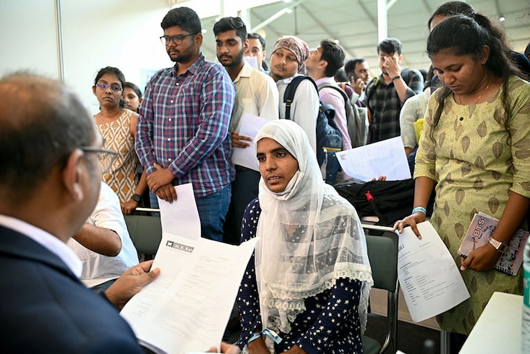 Job seekers attend a walk-in-interview during a state-level job fair organised by India"s Karnataka state government at the Palace Grounds in Bengaluru on February 26, 2024. On day one, 95,000 registered for two-day job fair.