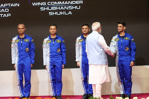 PM Modi with the four chosen astronauts, three of whom will man the Gaganyaan mission. Image: PIB PM Modi with the four chosen astronauts, three of whom will man the Gaganyaan mission. Image: PIB