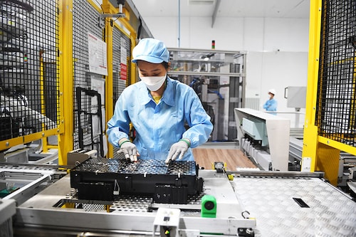 A worker assembles an electric car battery inside the battery pack shop at the electric automobile plant of VinFast in Haiphong, Vietnam. Image: Nhac Nguyen / AFP) A worker assembles an electric car battery inside the battery pack shop at the electric automobile plant of VinFast in Haiphong, Vietnam. Image: Nhac Nguyen / AFP)
