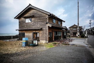 [CAPTION]Wooden buildings across Japan"s Noto Peninsula were demolished by a massive earthquake on New Year"s Day, but thanks to a quirk of architecture, one small fishing village stood strong. Image: Philip Fong / AFP
