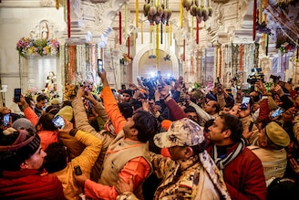 Devotees take pictures inside the Lord Ram temple after its inauguration, in Ayodhya, India on January 22, 2024.