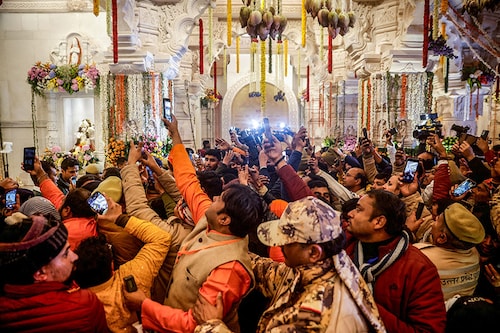 Devotees take pictures inside the Lord Ram temple after its inauguration, in Ayodhya, India on January 22, 2024.