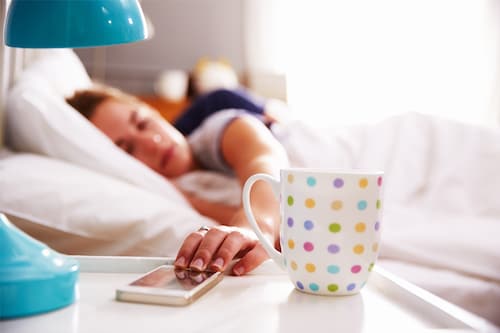 Looking at your phone as soon as you wake up predisposes you to be more distracted for the rest of the day. Image: Shutterstock Looking at your phone as soon as you wake up predisposes you to be more distracted for the rest of the day. Image: Shutterstock