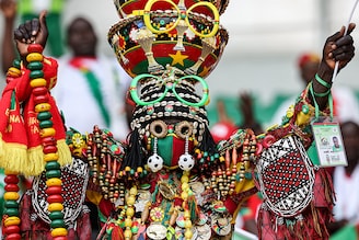 A Burkina Faso supporter, costumed, gestures ahead of the Africa Cup of Nations (CAN) 2024 round of 16 football match between Mali and Burkina Faso at the Amadou Gon Coulibaly Stadium in Korhogo on January 30, 2024.