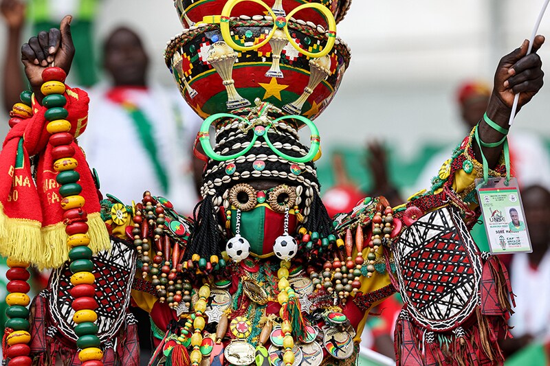 A Burkina Faso supporter, costumed, gestures ahead of the Africa Cup of Nations (CAN) 2024 round of 16 football match between Mali and Burkina Faso at the Amadou Gon Coulibaly Stadium in Korhogo on January 30, 2024.