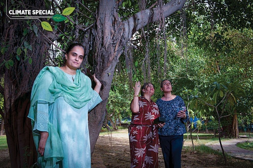 (From left): Bhavreen Kandhari, founder of WarriorMoms, with other members Vandana Narang and Chinky Singh, while they collect data of ambient temperature and AQI levels at a park in Defence Colony in New Delhi
Image: Amit Verma